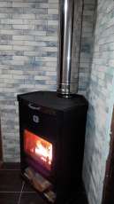 Стальной недорогой камин Теплодар ОВ-120 (угловой) фото в интерьере в Мозыре