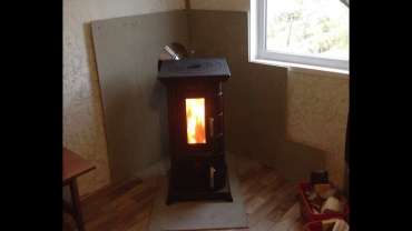 Отопительная печь Термофор Статика Тетра, чёрная бронза фото в интерьере в Мозыре