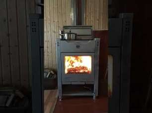 Стальной камин со стеклом Теплодар Кадриль фото в интерьере в Мозыре