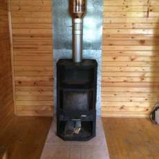 Печь-камин с шамотом Мета-Бел Ангара-Аква в интерьере фото в Мозыре