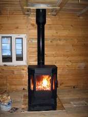 Печь-камин Бавария водяной с плитой в интерьере в Мозыре