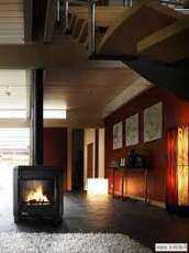 Печь-камин чугунный Invicta Carolo в интерьере Амазонка бай фото  в Мозыре