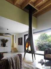 Печь-камин чугунный Invicta Pow-Wow в интерьере Амазонка бай фото в Мозыре