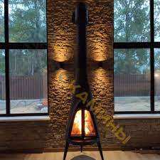 Печь-камин чугунный Invicta Pow-Wow в интерьере Амазонка бай фото в Мозыре